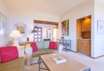 Splashes of red-accent pillows match the colors of the evening sky